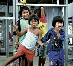 Children playing in the community centre which is a medical clinic, child care centre and community meeting place.